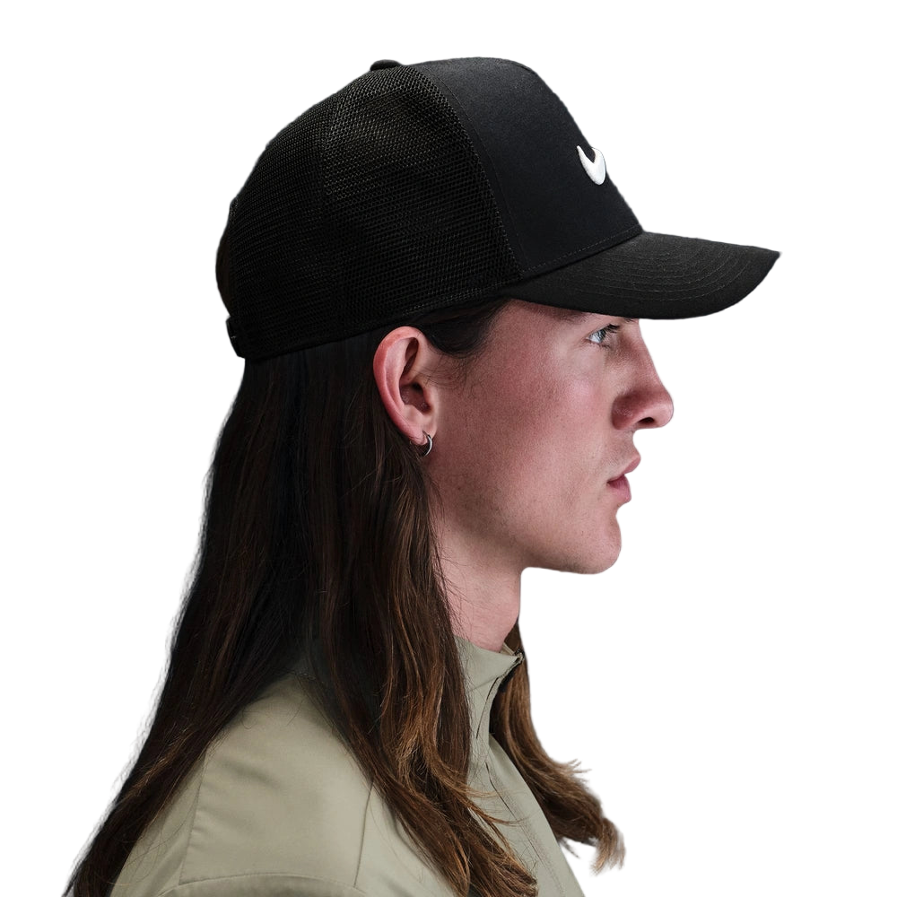 Side image of the Nike Rise Cap on a man in Black