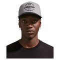 Main view of the Nike Rise Cap in Smoke Grey colourway, unisex model