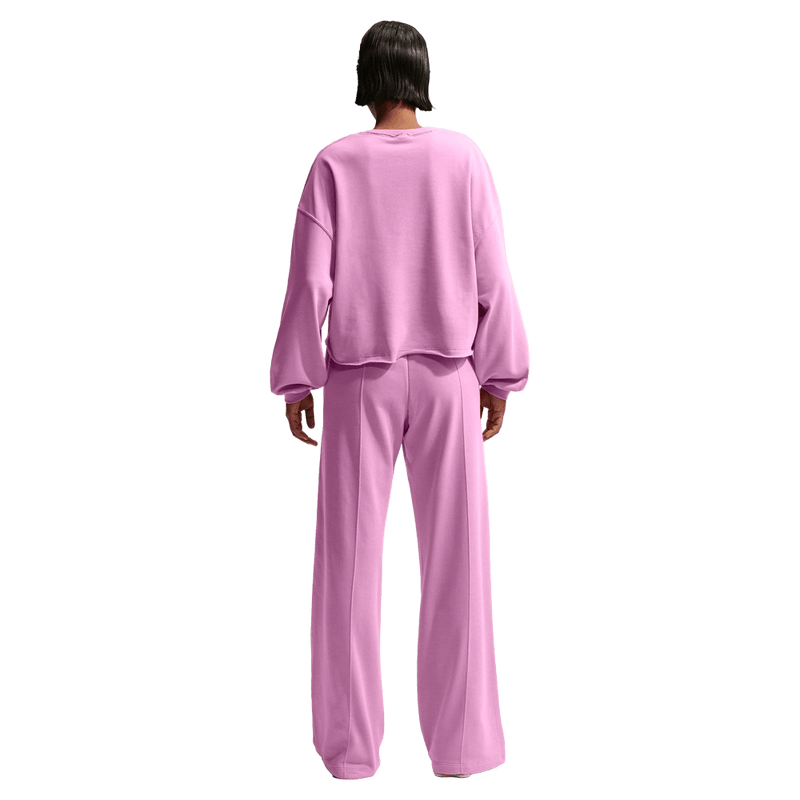 Back view of the Nike Sportswear Chill Terry Crew Neck in Light Magnenta colourway, women model
