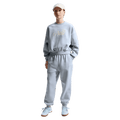 Front view of the Nike Sportswear Club Fleece Crew Neck in Ghost colourway, kids model
