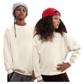 Main view of the Nike Sportswear Club Fleece Oversized Sweatshirt in Soft Pearl colourway, kids model
