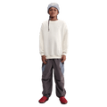 Front view of the Nike Sportswear Club Fleece Oversized Sweatshirt in Soft Pearl colourway, kids model