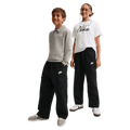 Kids view of the Nike Sportswear Club Woven Cargo Pants in Black and White colourway, kids model