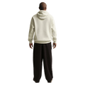 Back view of the Nike Sportswear Club Hoodie in Light Khaki colourway, unisex model