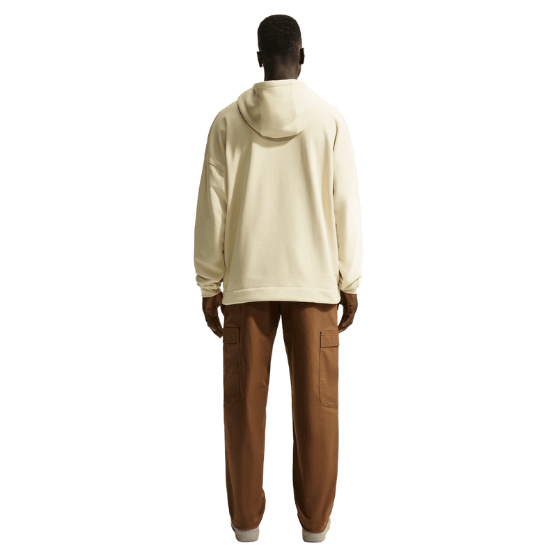 Back view of the Nike Sportswear Club Hoodie in Light Khaki and white colourway, unisex model