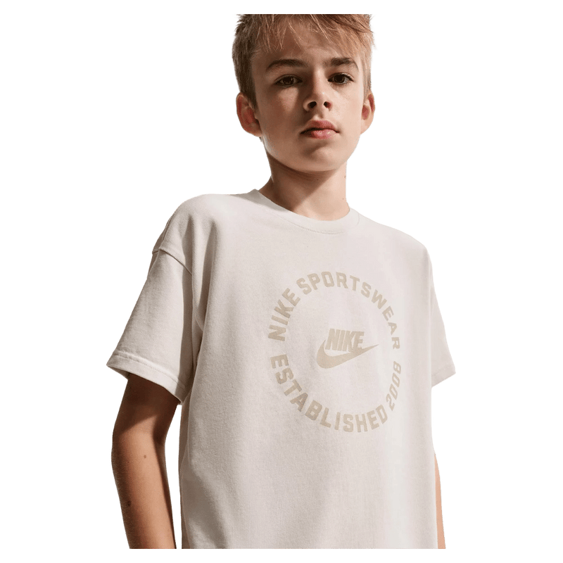 Main view of the Nike Sportswear Tee in Light Orewood Brown colourway, kids model