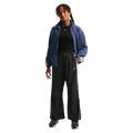 Front view of the Nike Sportwear Pants in Black colourway, kids model