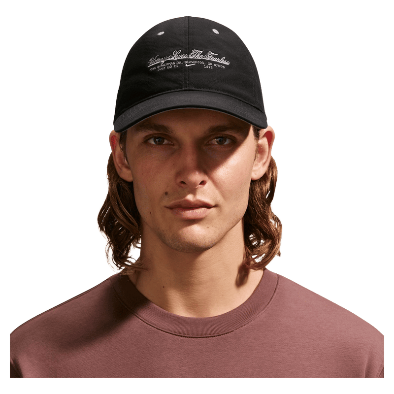 Front view of the Nike Unstructured Cap in College Grey colourway, unisex model