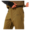 Detail view of the Oakley Best Cedar Rc Insulated Ski Pants in Army Green colourway, mens's model