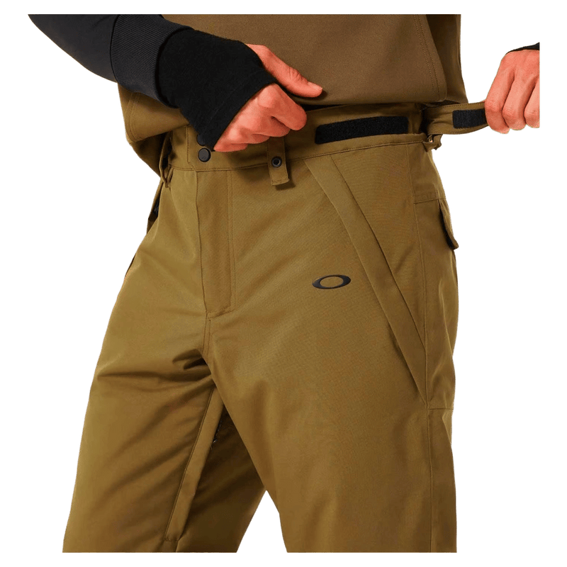 Detail view of the Oakley Best Cedar Rc Insulated Ski Pants in Army Green colourway, mens's model