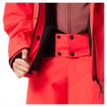 Powder skirt view of the Oakley Canopy Insulated Jacket in HIBISCUS RED colourway, women model