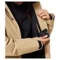 Media pocket view of the Oakley Canopy Insulated Jacket in Pebble colourway, women model