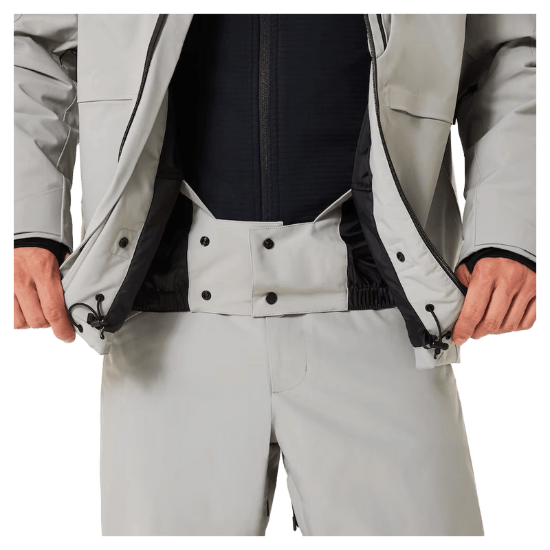 Powder skirt view of the Oakley Canopy Insulated Ski Jacket in Cement colourway, men's model