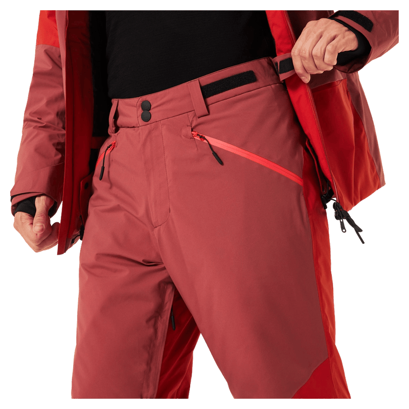 Waist view of the Oakley Canopy Pro Insulated Ski Pants in FLAME RED and ROSEWOOD colourway, men's model