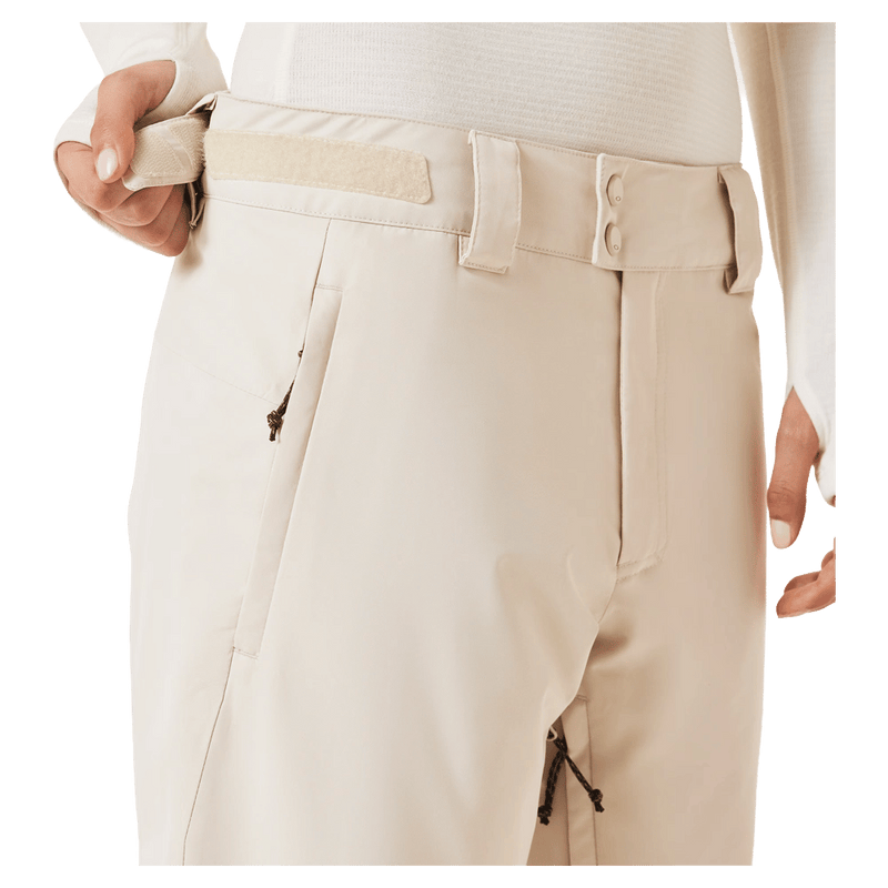Detail view of the Oakley Jasmine Insulated Ski Pants in Mist and Pebble colourway, women's model