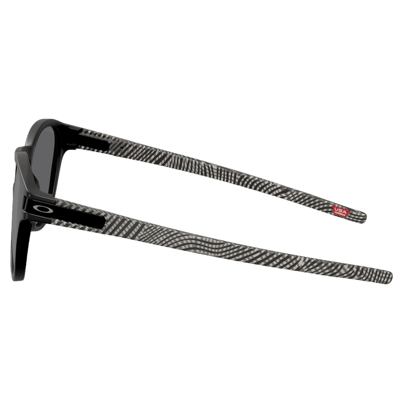 Side view of the Oakley Latch Sunglasses in Matte Black, Prizm Black Polar lens, unisex model