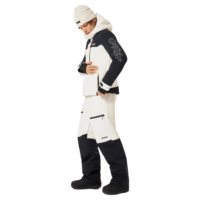 Full-body view of the Oakley Tnp Tbt Insulated Ski Jacket in Mist colourway, unisex's model