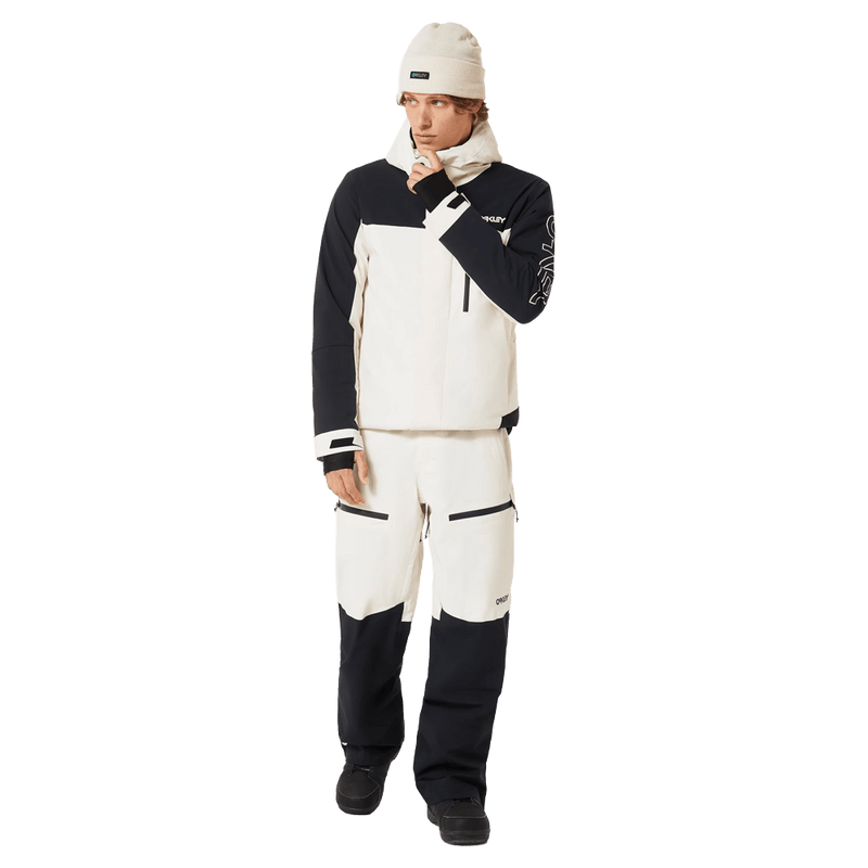 Full-body view of the Oakley Tnp Tbt Insulated Ski Jacket in Mist colourway, unisex's model