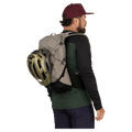 Carried view of the Osprey Raptor 14L Hydration Bag in Grey colourway, men model