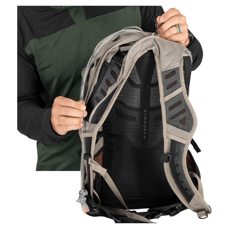 Strap pocket view of the Osprey Raptor 14L Hydration Bag in Grey colourway, men model