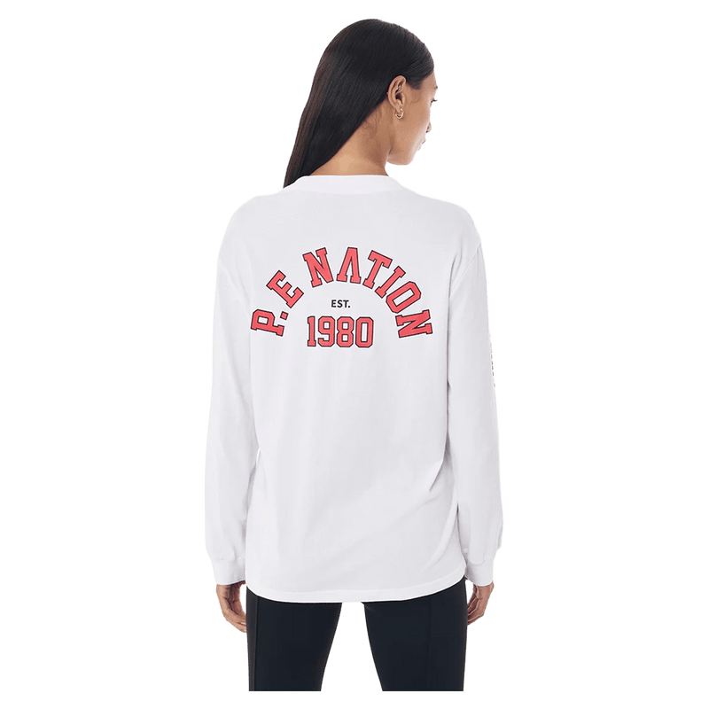 Back view of the P.E Nation Established Long Sleeve Tee in Optic White colourway, women model