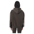 Back view of the P.E Nation Core Hoodie in Dark Olive colourway, women model