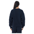 Back view of the P.E Nation Established Jumper in Dark Navy colourway, women model
