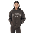 Front view of the P.E Nation Core Hoodie in Dark Olive colourway, women model