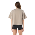 Back view of the P.E Nation Area Tee in Oatmeal colourway, women's model