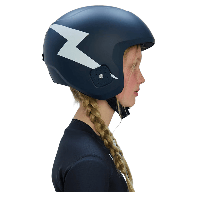 Matte navy blue Poc Skull Dura Jr kids ski helmet with a white lightning bolt graphic shown from a side profile.