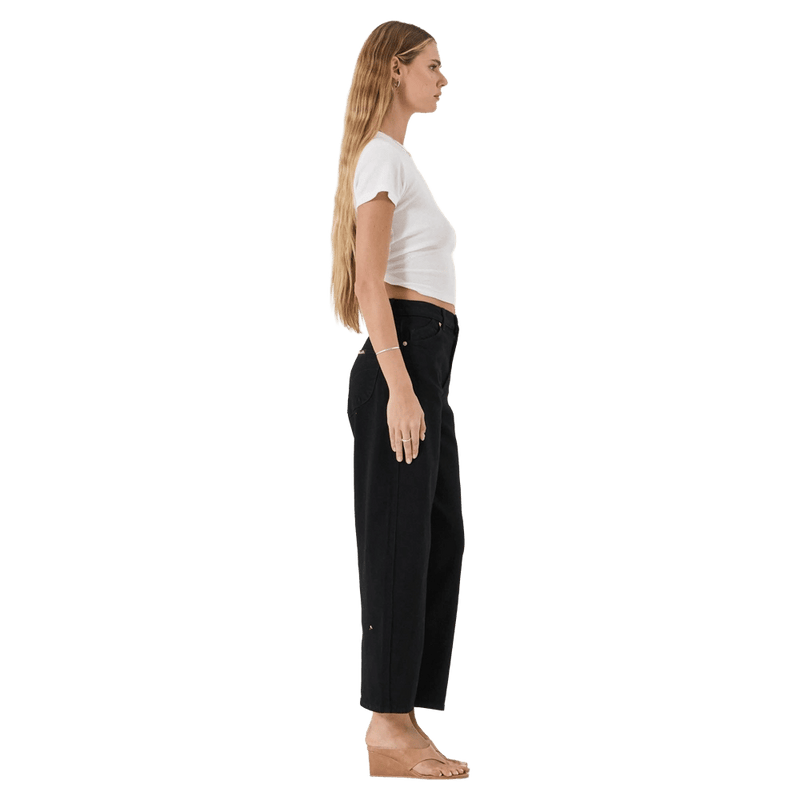 Side view of Rollas Gig Barrel Jeans - Womens in colour Jet Black.
