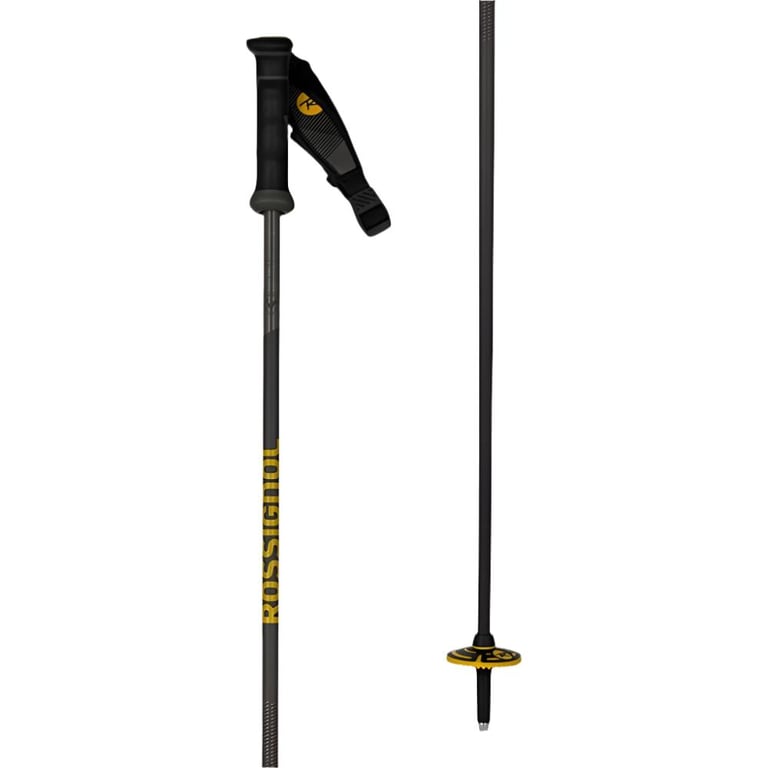 Rossignol Tactic Carbon Ski Pole with black shaft, black and yellow mountain basket. Yellow Rossignol branding on shaft and strap. Black handle and strap with velcro adjustment