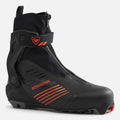 Black Rossignol X-9 Skate cross-country ski boot with orange accents, zippered lace cover, and supportive ankle wrap strap.