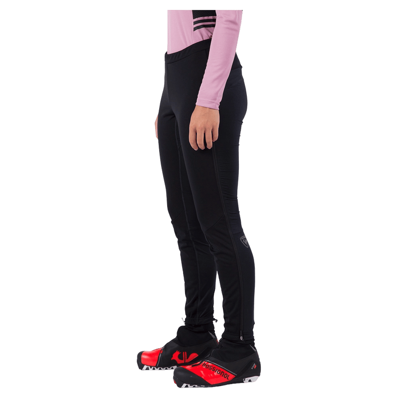 Side view of the Rossignol Genetys Pants in Black colourway, women model