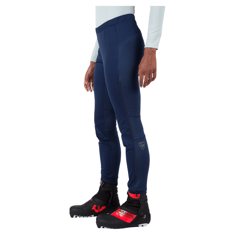 Side view of the Rossignol Genetys Pants in Dark Navy colourway, women model