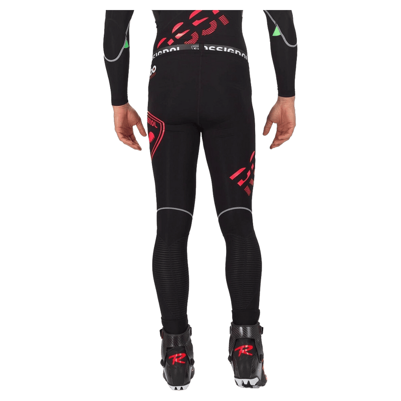 Back view of the Rossignol Infini Compression Race Tights in Neon Red colourway, men model