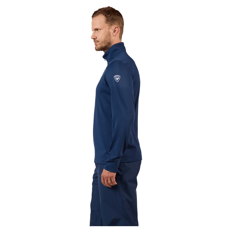 Side view of the Rossignol MID LAYER STRETCH HZ Fleece Top in Dark Navy colourway, men model