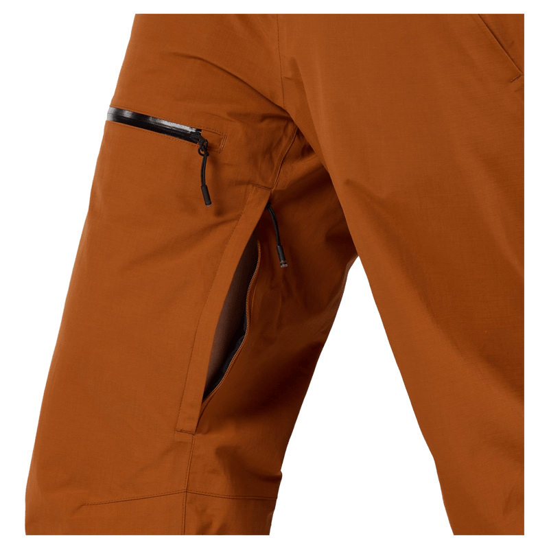 Vents view of the Rossignol Outerlimits Insulated Bib in DEEP CARAMEL colourway, women model