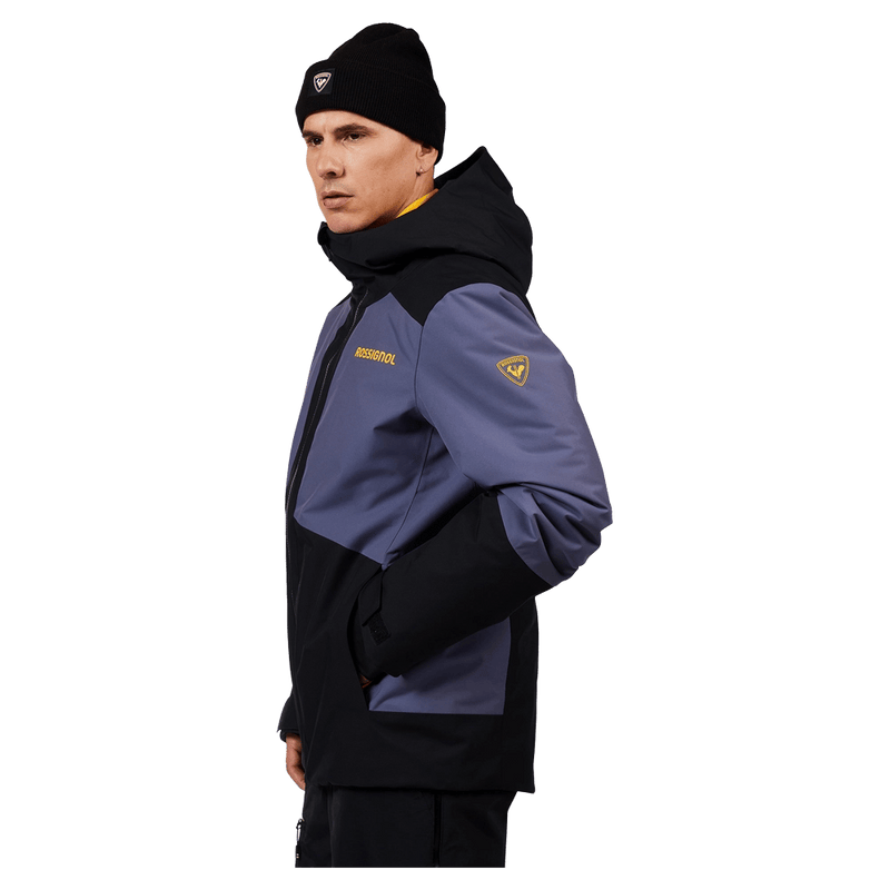 Side view of the Rossignol Rochrun Insulated Jacket in TRUE NIGHT BLUE colourway, men model