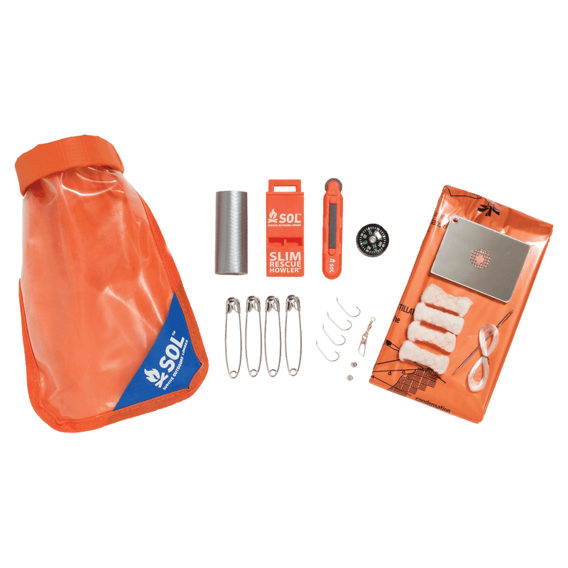 SOL Scout Survival Kit waterproof bag with clear plastic on one side and orange on the other shown separated with bag, contents of safety pins, rescue whistle compass, needle and thread, mirror etc.