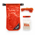 SOL Fire Lite Kit showing orange and clear dry bag, orange cord, white tinder quik and orange fire sparker.