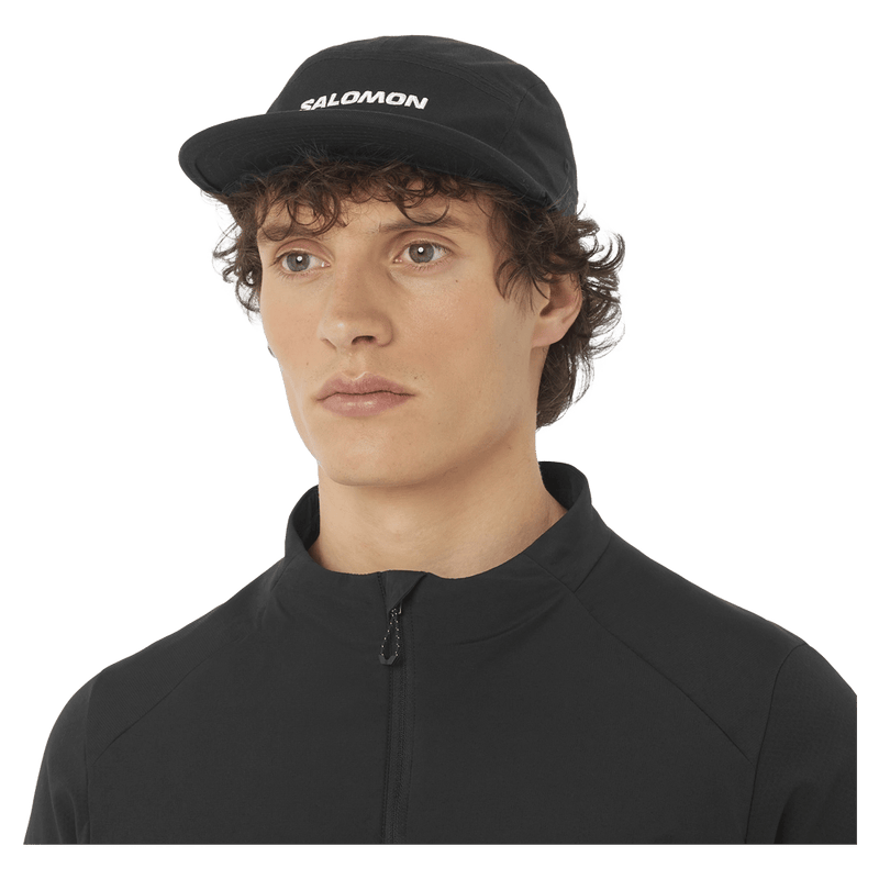 Worm view of the Salomon 5 Panle Cap in Deep Black colourway, unisex model
