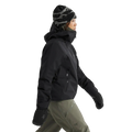 Side view of a woman wearing the Sentinel Ski Jacket in Black.