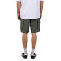 Back view of Man wearing Silent Theory's Cleaver Cargo Shorts in forest colourway