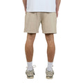 Back view of Man wearing Silent Theory's Essential Theory Shorts in tan colourway