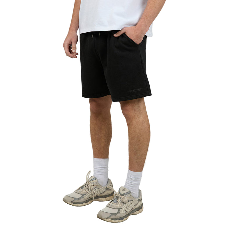 Man wearing Silent Theory's Essential Theory Shorts in black colourway
