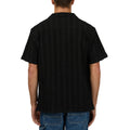 Back view of man wearing Luca SS Shirt in washed black colourway