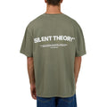 Back view of Men wearing Silent Theory's Stayin Ahead Tee in olive colourway