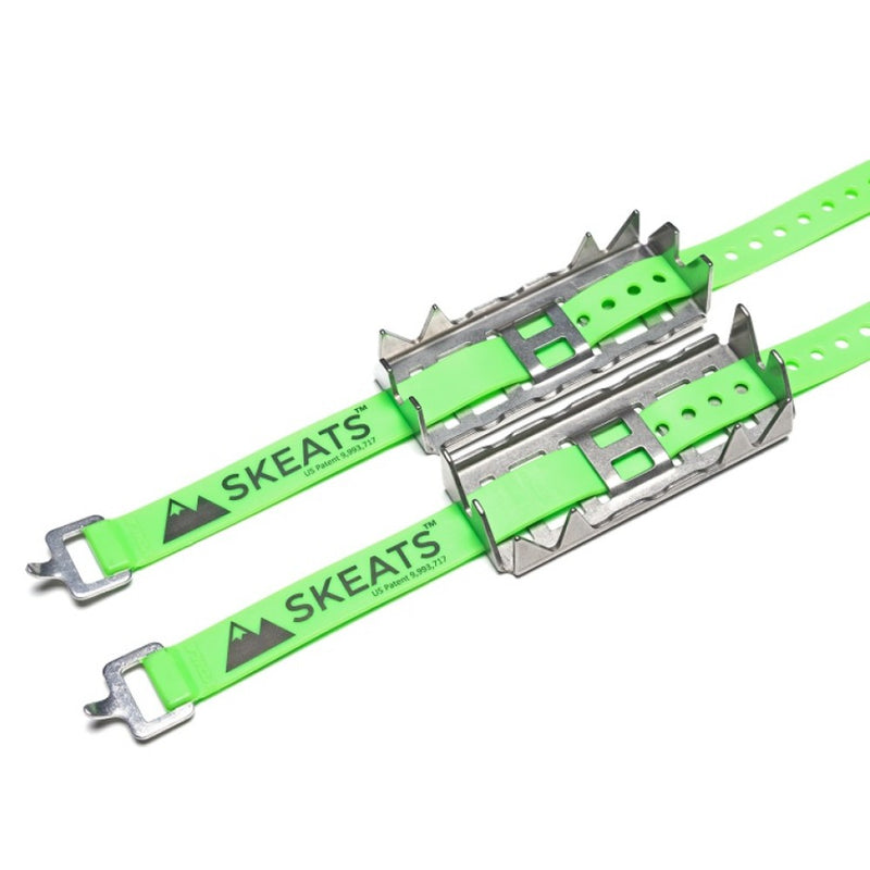 A pair of Green Voile Plastic Straps and Silver Metal Skeets Claw Cleats