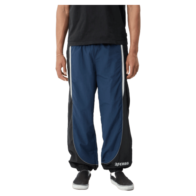 Front view of Afends Sporting Recycled Paneled Track Pants in colour Navy.